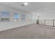 Bright bonus room with large windows and modern railing at 629 Soaring Wings Ave, Las Vegas, NV 89183
