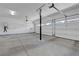Spacious three-car garage with high ceilings and ample lighting at 629 Soaring Wings Ave, Las Vegas, NV 89183
