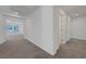 Hallway view with carpet, white walls, and access to other rooms at 629 Soaring Wings Ave, Las Vegas, NV 89183