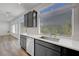 This kitchen has stainless steel appliances, a large window, and a sliding glass door at 629 Soaring Wings Ave, Las Vegas, NV 89183