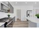 Modern kitchen featuring stainless steel appliances, white countertops, and ample cabinet space at 629 Soaring Wings Ave, Las Vegas, NV 89183