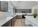 Kitchen features gray cabinets, white countertops, and stainless steel dishwasher at 629 Soaring Wings Ave, Las Vegas, NV 89183
