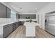 Contemporary kitchen with gray cabinetry, stainless steel appliances, and a large island at 629 Soaring Wings Ave, Las Vegas, NV 89183