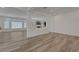 Open-concept living room with wood-look flooring and abundant natural light at 629 Soaring Wings Ave, Las Vegas, NV 89183