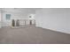 Spacious loft area with carpet flooring, natural light, and modern railing at 629 Soaring Wings Ave, Las Vegas, NV 89183