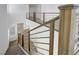 View of staircase featuring modern railings and wood-look flooring at 629 Soaring Wings Ave, Las Vegas, NV 89183