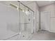 Bright bathroom features a glass enclosed shower with bench seat, and chrome hardware at 6909 Toll Mountain St, North Las Vegas, NV 89086