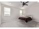Comfortable bedroom with neutral tones, a ceiling fan, and plush carpeting creating a serene retreat at 6909 Toll Mountain St, North Las Vegas, NV 89086