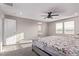 Serene bedroom with soft carpet, ample natural light, and an adjoining bath and closet area at 6909 Toll Mountain St, North Las Vegas, NV 89086