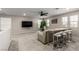 Spacious bonus room featuring a lounge area, TV, and bar seating for entertaining and relaxation at 6909 Toll Mountain St, North Las Vegas, NV 89086