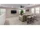 Spacious bonus room featuring a lounge area, TV, and bar seating for entertaining and relaxation at 6909 Toll Mountain St, North Las Vegas, NV 89086