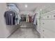 Well-organized walk-in closet with ample shelving, clothing racks, and drawer space for storage at 6909 Toll Mountain St, North Las Vegas, NV 89086