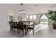 Bright dining area with modern lighting and access to the backyard, creating a welcoming atmosphere for meals at 6909 Toll Mountain St, North Las Vegas, NV 89086