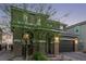 Two-story home featuring a brick driveway, attached garage, and charming architectural details at 6909 Toll Mountain St, North Las Vegas, NV 89086