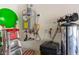 This garage shows the water heater and water conditioning system at 6909 Toll Mountain St, North Las Vegas, NV 89086