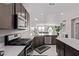 Modern kitchen features stainless steel appliances, white countertops, and an open layout at 6909 Toll Mountain St, North Las Vegas, NV 89086