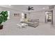 Comfortable living room featuring plush seating, a large window and modern decor at 6909 Toll Mountain St, North Las Vegas, NV 89086