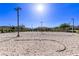 Sandy volleyball court surrounded by desert landscape, perfect for outdoor games and recreation at 6909 Toll Mountain St, North Las Vegas, NV 89086