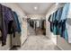 Spacious walk-in closet with custom shelving and ample storage space for clothes and accessories at 6909 Toll Mountain St, North Las Vegas, NV 89086