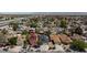 Expansive aerial view of a neighborhood with various homes, greenery, and roadways at 6924 Senton Ave, Las Vegas, NV 89108