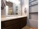 The spacious bathroom is equipped with dual sinks, granite countertops and cabinet storage at 6924 Senton Ave, Las Vegas, NV 89108
