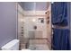 The bathroom features a modern glass shower with built in seat and shower caddy at 6924 Senton Ave, Las Vegas, NV 89108