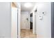 The hallway leads to other rooms and includes neutral paint and tile flooring at 6924 Senton Ave, Las Vegas, NV 89108