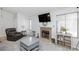 Bright living room featuring a stone fireplace, mounted TV, and comfortable seating at 6924 Senton Ave, Las Vegas, NV 89108