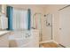 Bathroom features soaking tub and glass enclosed shower at 7559 Chambery Cove Ct, Las Vegas, NV 89123