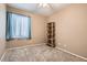 Bedroom with neutral carpet and window at 7559 Chambery Cove Ct, Las Vegas, NV 89123