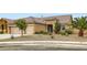 Single-story home featuring desert landscaping, a two-car garage, and a cozy entrance at 7559 Chambery Cove Ct, Las Vegas, NV 89123