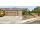 Charming single-story home featuring a desert landscape and a spacious two-car garage at 7559 Chambery Cove Ct, Las Vegas, NV 89123