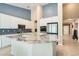 Modern kitchen with granite countertops, white cabinetry, and stainless steel appliances at 7559 Chambery Cove Ct, Las Vegas, NV 89123