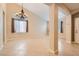 Bright and airy living room with tile flooring, neutral walls, and elegant lighting at 7559 Chambery Cove Ct, Las Vegas, NV 89123