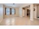 Bright living room with tile flooring, neutral walls, and large windows with natural light at 7559 Chambery Cove Ct, Las Vegas, NV 89123