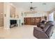 Spacious living room with tile flooring, fireplace, and built-in bookcase at 7559 Chambery Cove Ct, Las Vegas, NV 89123