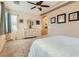 Spacious main bedroom with large closet, neutral colors, and ceiling fan at 7559 Chambery Cove Ct, Las Vegas, NV 89123
