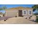 Charming single-story home showcasing a stone facade, neutral colors, and a two-car garage at 77 Serene Tempo Ave, Henderson, NV 89011