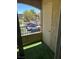 Cozy balcony with artificial turf offers a quaint outdoor space and neighborhood views at 7885 W Flamingo Rd # 2129, Las Vegas, NV 89147