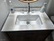 Bathroom with a modern under mount sink and wooden vanity at 7885 W Flamingo Rd # 2129, Las Vegas, NV 89147