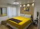 Bright bedroom with unique wall decor, ceiling fan, and stylish furnishings at 7885 W Flamingo Rd # 2129, Las Vegas, NV 89147