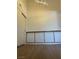 Minimalist bedroom design with white walls, wood floors, and a closet, offering a serene space at 7885 W Flamingo Rd # 2129, Las Vegas, NV 89147