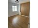 Empty bedroom featuring hardwood floors, natural light, and a minimalist design at 7885 W Flamingo Rd # 2129, Las Vegas, NV 89147