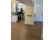 Updated kitchen features white cabinets, stainless steel appliances, and new wood flooring at 7885 W Flamingo Rd # 2129, Las Vegas, NV 89147