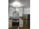 Modern kitchen boasts stainless steel appliances and stylish backsplash at 7885 W Flamingo Rd # 2129, Las Vegas, NV 89147