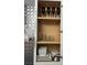 Kitchen cabinet organized with dishes and stemware at 7885 W Flamingo Rd # 2129, Las Vegas, NV 89147
