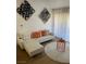 Cozy living room featuring a white sofa, accent pillows, and unique wall art for a stylish atmosphere at 7885 W Flamingo Rd # 2129, Las Vegas, NV 89147