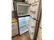 Stainless steel top-freezer refrigerator with open doors and adjustable shelving at 7885 W Flamingo Rd # 2129, Las Vegas, NV 89147