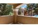 Balcony view of the complex, pool, and mature landscaping from an apartment building at 8101 W Flamingo Rd # 2110, Las Vegas, NV 89147