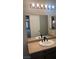 Bathroom featuring granite countertops, vanity and modern lighting at 8101 W Flamingo Rd # 2110, Las Vegas, NV 89147